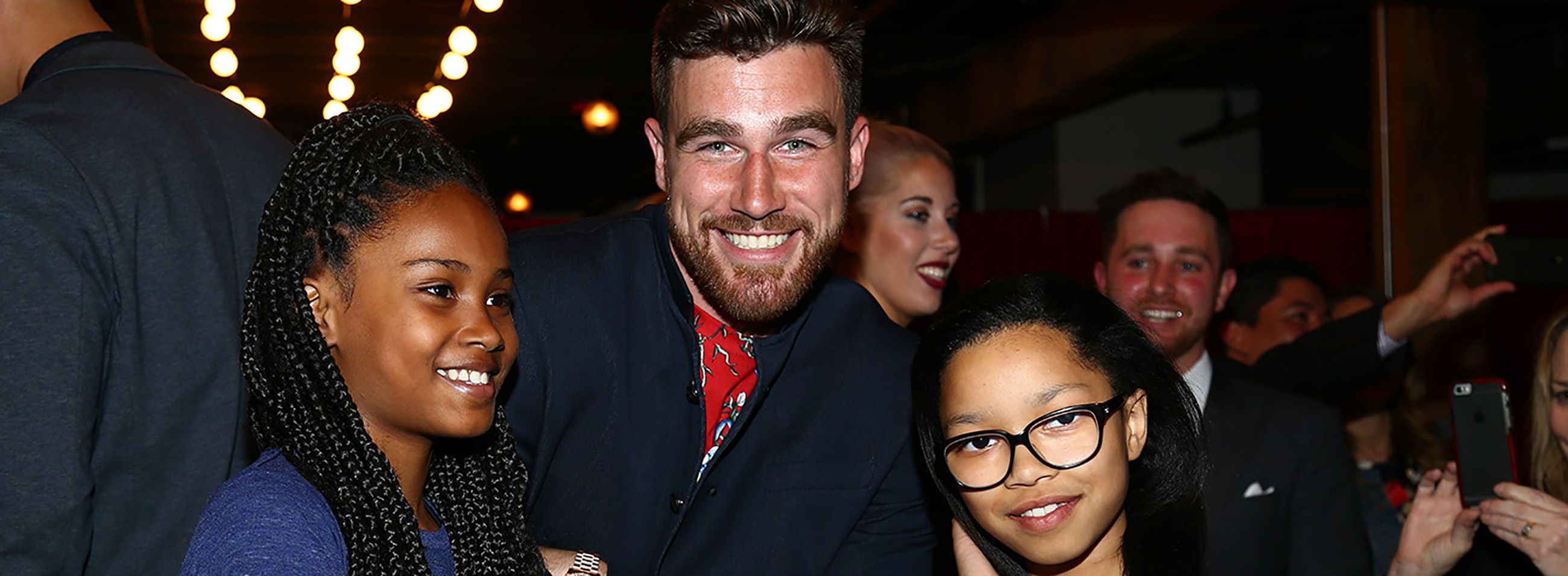 Travis Kelce and girls at Walk the Walk event